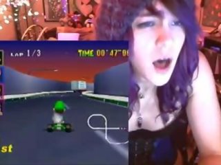 Geek schoolgirl cums playing Mario Kart
